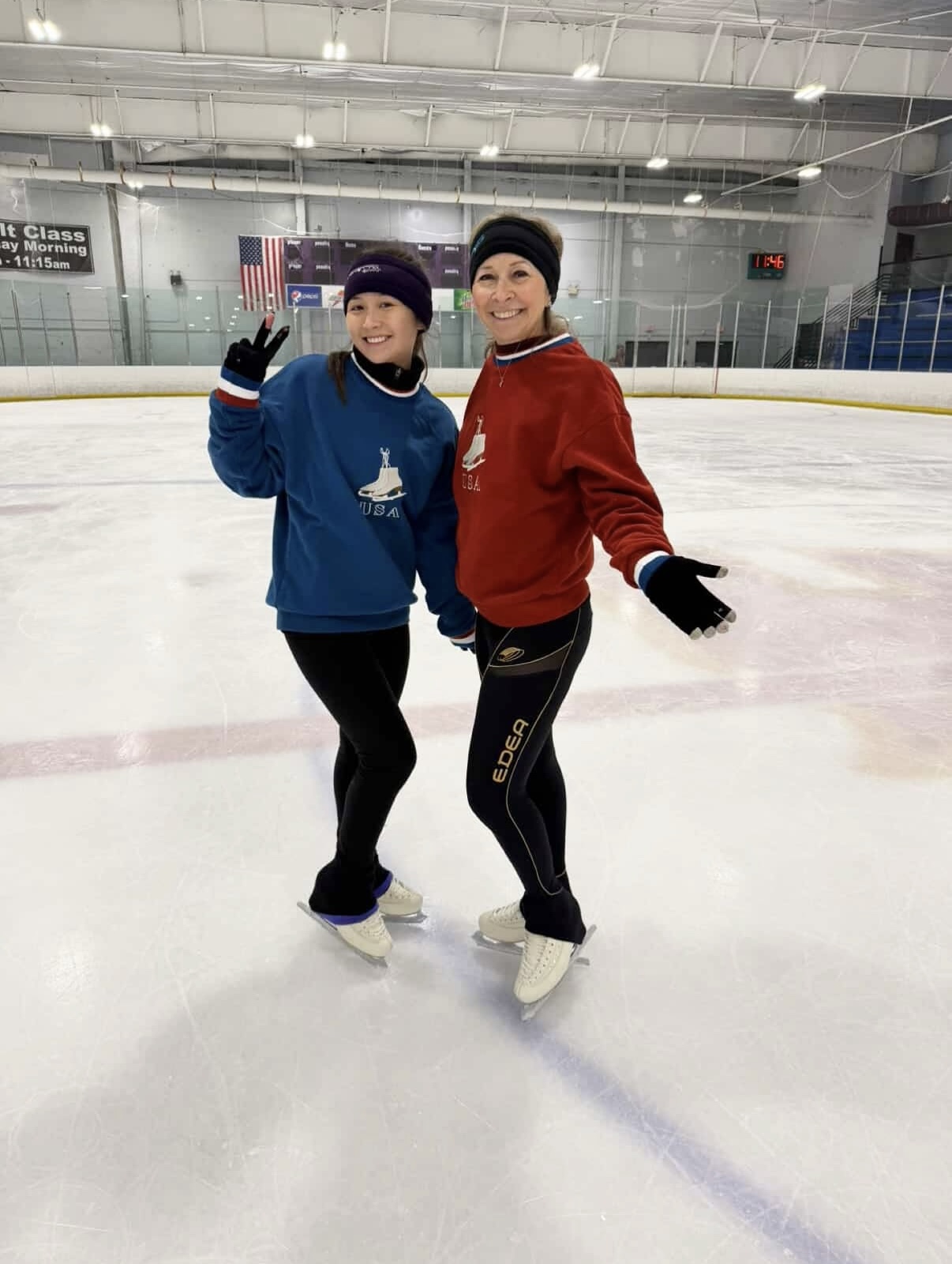 Skaters on the ice wearing the Blue USA crewneck